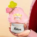 A person is holding the Robotime Nanci Plush Potted Plant