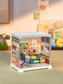 Atmospheric presentation of the Robotime Nature Energy Fruits, plastic miniature fruit store in a small display case