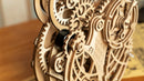 Close-up of the gears and timer mechanism of the Robotime Owl Clock