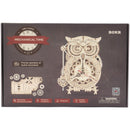 Front of package of the Robotime Owl Clock, wooden model kit of a mechanical, standing clock
