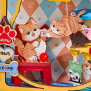 Cats playing in the shop window of the Robotime Pawfect Pet Shop