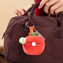 Keep Well variant of the Robotime Plush Pendant Nanci Stress-Relief series, hanging from a bag