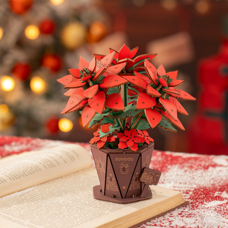 Atmospheric presentation of the Robotime Poinsettia, wooden construction set of a Christmas flower