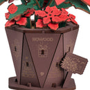 Details of the pot, little sign and a few small flowers of the Robotime Poinsettia