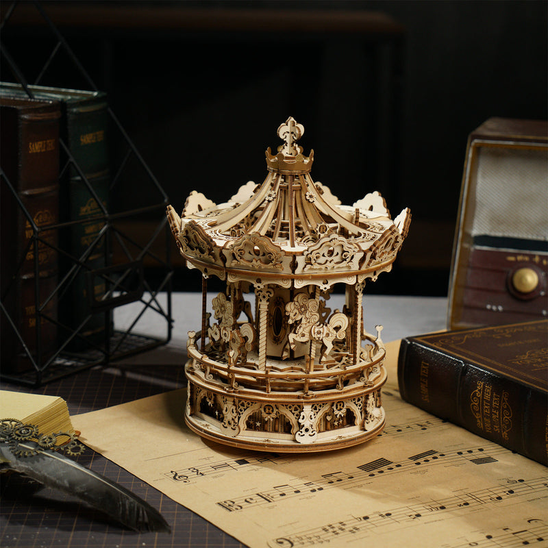 Atmospheric presentation of the Robotime Romantic Carousel, wooden construction kit for a rotating music box in the shape of an old-fashioned carousel