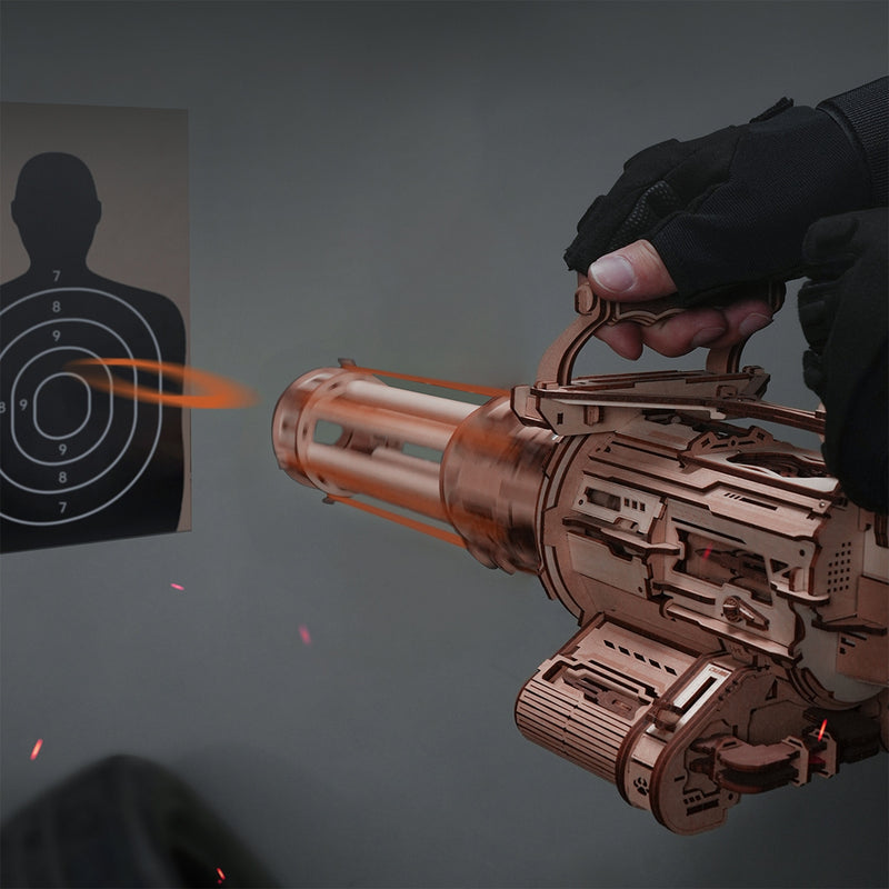 A person firing the Robotime Rotating-Barrel Machine Gun at a target
