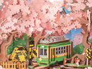 Details of the sakura trees and the greem tram car on the railroad crossing of the Robotime Sakura Dreamy Tour