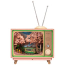 Product photo of the Robotime Sakura Dreamy Tour, wooden construction set of a small tv with a tram car inside