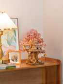 Atmospheric presentation of the Robotime Sakura Tree House, wooden construction set of a tree house in a Japanese cherry blossom tree