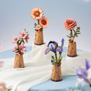 The Robotime Sakura, Light Orange Gerbera, Pink Dahlia, and Purple Moth Iris from the Wooden Bloom Craft series