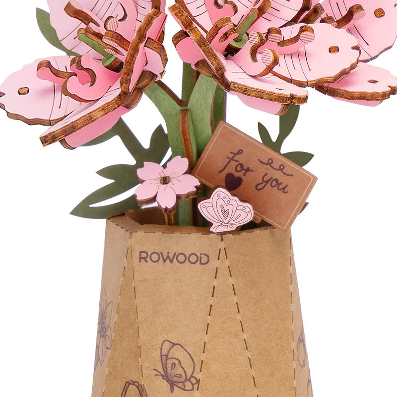 Details of the flowers, vase and small sign of the Robotime Sakura