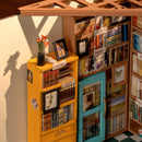 Close-up of the cabinets full of books and drawings of the Robotime Sam’s Study