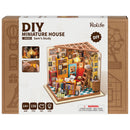 Front of package of the Robotime Sam’s Study, DIY miniature house of a cozy bookstore