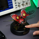 A person uses the touch button to activate the Robotime Scout Beetle