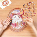 A person is putting the Robotime Springtime Kitty Portrait jigsaw puzzle together