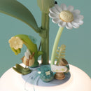 Flowers, leaves, and a bee at the bottom of the flower of the Robotime Starry Camellia Lamp