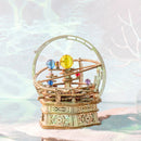 Atmospheric presentation of the Robotime Starry Night, wooden construction kit for a music box in the shape of a small planetarium