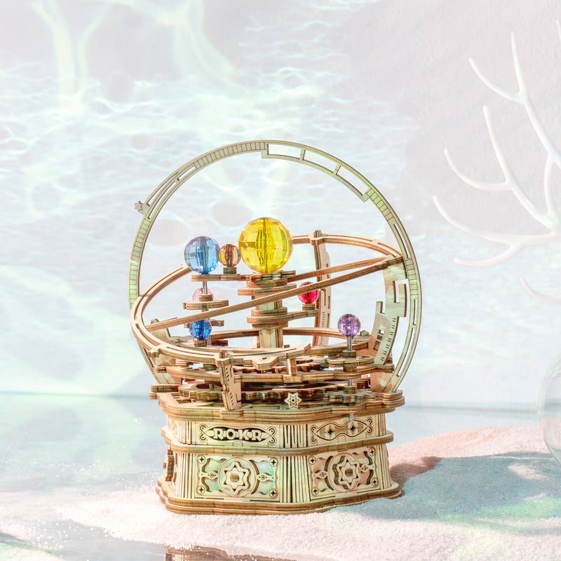 Atmospheric presentation of the Robotime Starry Night, wooden construction kit for a music box in the shape of a small planetarium