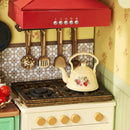 The old-fashioned whistling kettle on the gas stove in the Robotime Sunlit Farmhouse Kitchen