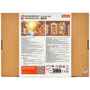 Back of package of the Robotime Sunset Isle, building kit for a book nook featuring a sunset at a beautiful vacation destination