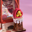 Chocolates in a heart-shaped box at the Robotime Sweet Chocolate Shop