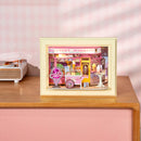 Atmospheric presentation of the Robotime Sweet Scoopery Ice Cream, diorama in a frame of an ice cream cart in front of a cute ice cream shop