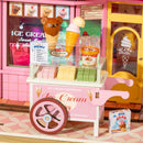 Pink ice cream cart in front of the Robotime Sweet Scoopery Ice Cream shop