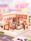 Atmospheric presentation of the Robotime Tasty Cake Shop, plastic miniature house of a cute, pink cake shop