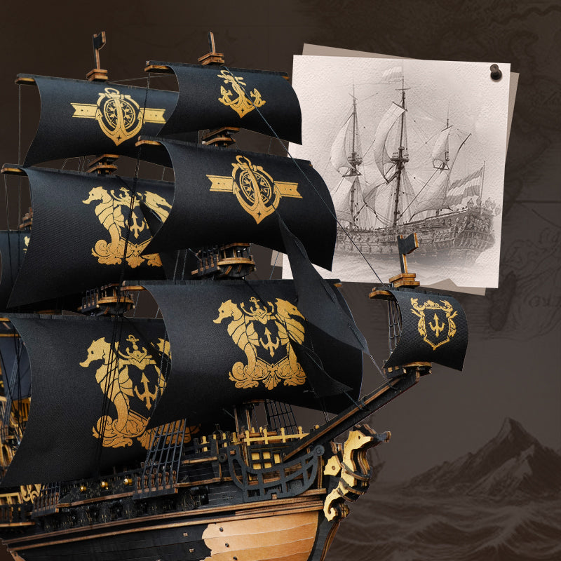 Bow and sails of the Robotime Seahorse Barque with a sketch of a sailing ship in the background