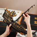 A person building the Robotime Seahorse Barque