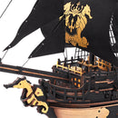 Bow of the Robotime Seahorse Barque, black wooden sailing ship with golden details