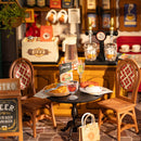 Close-up of a table with chairs and the bar in the background of the Robotime Tipsy Restaurant