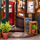 Plants and signs in front of the entrance of Robotime Tipsy Restaurant
