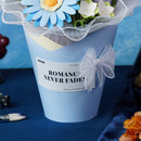 Close-up of the vase with a bow and the “Romance Never Fades” print from the Robotime Twilight Sky Bouquet