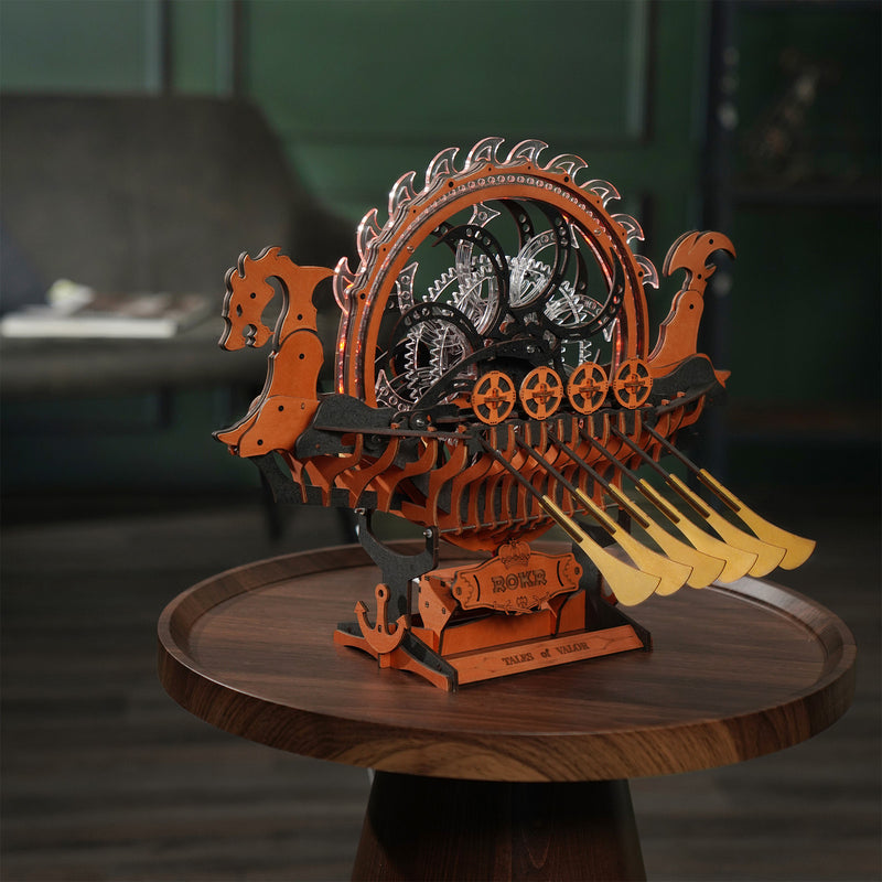 Atmospheric presentation of the Robotime Viking Dragon Ship, wooden construction set of a Viking ship with moving oars and an illuminated wheel on the deck