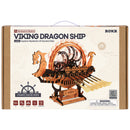 Front of package of the Robotime Viking Dragon Ship, wooden construction set of a Viking ship with moving oars and an illuminated wheel on the deck
