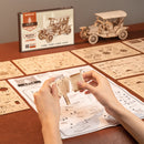 A person is building the Robotime Vintage Classic Car