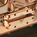 A box on the foot board of the Robotime Vintage Classic Car