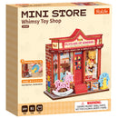 Front of package of the Robotime Whimsy Toy Shop, construction kit for a miniature toy store with old-fashioned toys