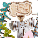 Close-up of the decorative sign with bow in the Robotime Wooden Flower Basket