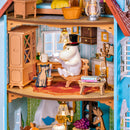 Moominpappa is reading a newspaper in the Rolife Moominhouse