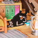 Stinky is lying on the floor, looking relaxed, in the Rolife Moominhouse
