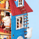 Moomintroll climbs a rope ladder on the outside of the Rolife Moominhouse