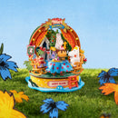 Atmospheric presentation of the Rolife Snorkmaiden’s Garden Party, construction kit for a Moomin miniature in which Snorkmaiden is served a buffet by Moomintroll