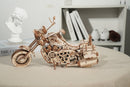 Atmospheric presentation of the Robotime Motor, wooden model kit of a driving motorcycle